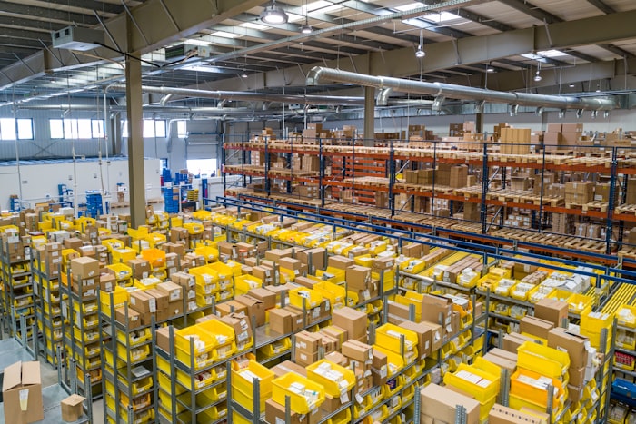 Global logistics network with automated warehouse operations and intelligent routing